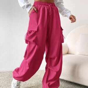 Hot pink cargo parachute pants